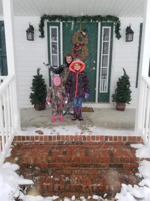 Ryan, Kayley and Avery Bradford watch the snow come down in Millsboro in this photo submitted by their mom, Leah Hudson.