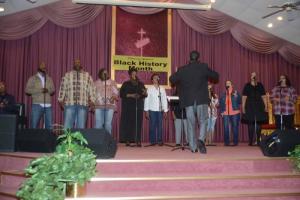 The Trinity Faith Christian Center choir, under direction of
Conductor and Minister André Jones, sang several songs during the program. Shown are Tony Harris, Lloyd Driffin, Wescenia Wise, Asia Holloman, Yvonne Kennedy, Delphine Rideau, Michelle Rideau, Terri Dukes, Jymayce Wescott and Shelly Jones. Trinity faith