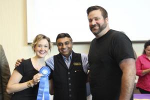 Maggie Morrison, left, and Jared LaJoie celebrate Stingray's first-place finish in the Best Cake category with Harry Keswani, founder of the Harry K Foundation.