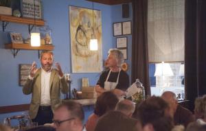 Richard Smock, wine sales manager at Kinsella, left, and Richard Davis talk to diners about the Kinsella Estates wines and the course combinations.