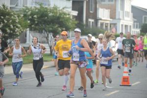 Runners head down Surf Avenue toward Henlopen Acres.