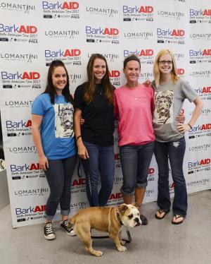 Oslo the baby bulldog good-luck charm, recently had surgery on his legs costing nearly $12,000. This is a sample of one thing Grass Roots Rescue does for it’s mission. Shown with ‘Oz’ are (l-r) Amanda Smith Brittani Clegg Karli Crenshaw and Jennifer Garcia.