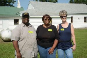 Mount Joy Civic Association President and Pastor of Mount Joy St. John Second Baptist Church the Rev. Thomas Sturgis stands with Sussex Housing Alliance co-chair Lillian Harrison, center, and Sussex Housing Alliance volunteer Carolyn Quinn. Rock the Block