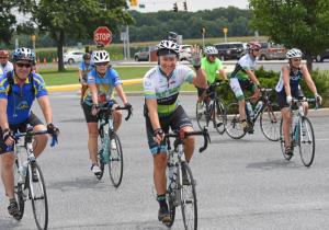 Former Gov. Jack Markell waves as he rides into the parking lot at Cape Henlopen High School in Lewes. NICK ROTH PHOTO
