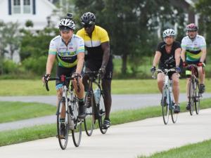 Jack Markell rides through the Hawks Eye development in Lewes toward the Junction and Breakwater Trail. NICK ROTH PHOTO