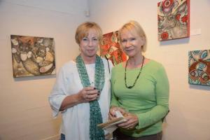Browsing Lynnette Shelley’s animal paintings are Joan Puglia and Helen Schneck from Rehoboth Beach. RAL Raubacher