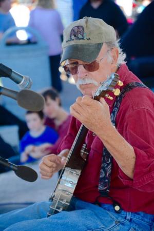 Patrick McCoy of Front Royal, Va., takes part in the banjo competition at the bandstand. RON MACARTHUR PHOTO