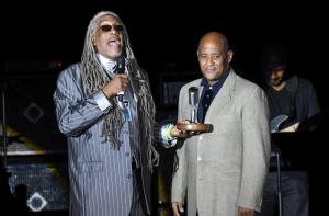 Producer Gary Spencer, right, is presented with the Rehoboth Beach Jazz Fest Producer of the Year Award from Emcee Perky Scott.