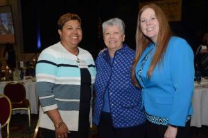 Socializing at the reception are (l-r) United Way’s Michelle Taylor, FSCAA board member Beryl Barmoore and Bank of America’s April Birmingham. FSCAA 52nd