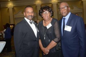 Stanford L. Bratton Award recipient the Rev. Dr. John Moore Sr., left, pauses to chat with Theresa and Melvin Hankerson. FSCAA 52nd