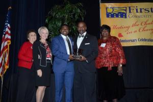 The Stanford L. Bratton Award was presented to the Rev. Dr. John G. Moore Sr. As a motivational speaker, leadership facilitator and mentor, he has positively impacted thousands of youth in organizations across the First State. Shown at the presentation are (l-r) Board President Peggy Strine, Lt. Gov. Bethany Hall-Long, John Moore Jr., award recipient the Rev. Dr. John G. Moore Sr., and Executive Director Bernice Edwards. FSCAA 52nd
