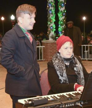 Clear Space Theatre Artistic Director David Button stands by to turn the page for pianist Melanie Bradley.
