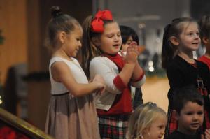 The 4-year-old Pelicans class happily sings “S-A-N-T-A.” Shown in back are (l-r) Sophia Bautista, Samantha Sander, Bryan Buruca and Katy Evans. In front, Karina Dare and Owen Blondin. Epworth Christmas