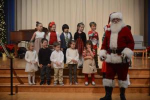 Closing out the program with “Santa Claus is Coming to Town” is the Pelicans class with Santa making a surprise entrance. Shown in back are (l-r) Sophia Bautista, Samantha Sander, Bryan Buruca, Katy Evans, Tucker Webster and William Mitchell. in front, Karina Dare, Owen Blondin, Sam Bouloucon, Morgan Ryan, Julia Petito and Santa Claus. Epworth Christmas