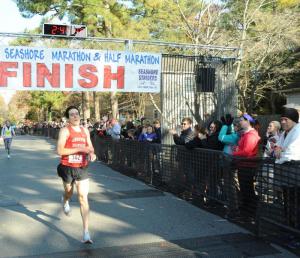 Marathon winner Jon Chesto crosses the finish line in 2:44:35. DAVE FREDERICK PHOTO