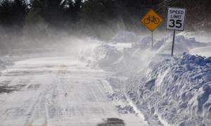 Blowing snow will continue to be a problem on Jan. 6 as it is along Gills Neck Road near Lewes. RON MACARTHUR PHOTO