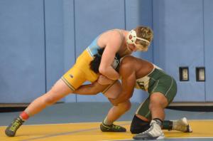 Cape’s Jackson Handlin tries to gain control over Mt. Pleasant’s Jordan Collins in a 145-pound bout.