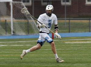 Junior defender Brody McMahon scoops a ground ball and starts a Vikings fast break.