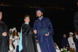 Anthony Harrison from Millsboro shakes hands with Director Dr. Patricia Oliphant after receiving his diploma. Sussex Academy grads