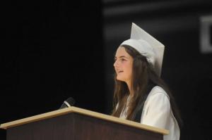 Graduate Kierstin Blatzheim speaks to the audience about a bench the class is donating to the school. Sussex Academy grads