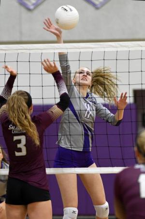 Royals senior Hannah Picconi directs a kill shot past the Jaguars’ Alex Morrison.