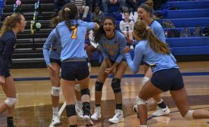 Cape’s Simran Patel, center, celebrates a kill in the fifth set.