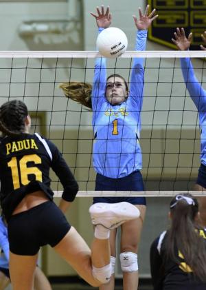 Cape sophomore Katie Knarr blocks a kill attempt by Padua’s Jessica Molen.