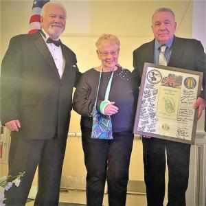 Shadow box presentation attendees shown are (l-r Dave Skocik, event emcee; honoree Rhona Prescott and Joe Startt Jr., president of Kent County Chapter 850, Vietnam Veterans of America.