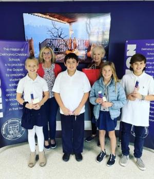 Gathered at the Delmarva Christian Schools Milton Campus for the pencil delivery are in back (l-r) DAR representatives Karen Parker and Carol Evans. In front are fourth-grade students Bailey Lubach, Hank Davis, Estella Megee and Malachi Hostedler.