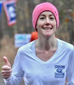 Gina Polizzi gives a thumbs-up for the Surfgimp Foundation.