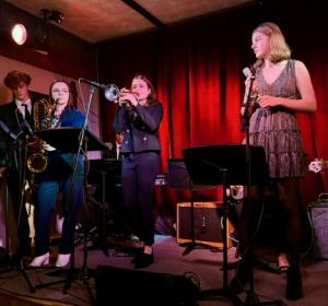 Taking the stage at The Room at Cedar Grove are Cape Henlopen High School Jazz Band musicians (l-r) Conor Wiedmann, Abby Stinar and Amelia Bickel; and singer Marley Fyock.