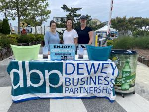 Greeting shoppers at the 2023 Dewey Arts and Fun Festival are Dewey Business Partnership volunteers (l-r) Beth Salaman, Pava Cohen and Janine DiPaula Stevens. ELLEN DRISCOLL PHOTO