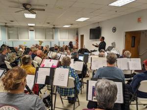 Under the direction of Steven Kieley, Rehoboth Concert Band members rehearse for their May 4 show in Milton Memorial Park. SUBMITTED PHOTO