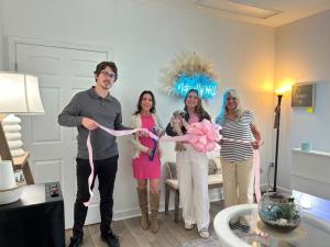 Ribbon-cutting attendees shown are (l-r) Tony Row, Stacey Row, Samantha Row holding Chocho, and Alexis Brown. SUBMITTED PHOTO