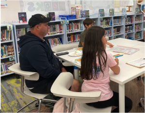Exploring the make-and-take activities are (l-r) Fernando Ribeiro and his two children, Evellyn and Kellvyn De Paula Ribeiro.