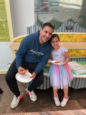 Enjoying pizza after their session and take-home activities supporting math and literacy are Asaf and Rose Ohana.