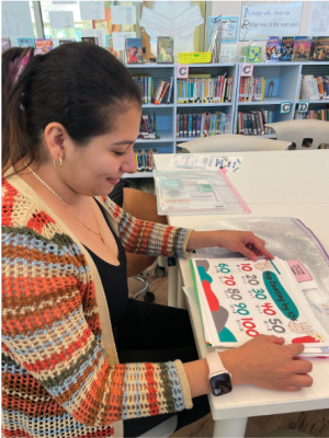 Applying the Bridges skip counting strategy that helps develop essential math skills is Jennifer Quintanilla, left, with her mother Janet Alarcon.