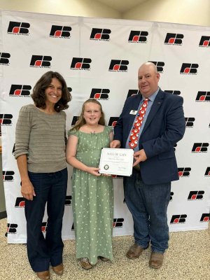 On hand for the Rate of Gain Award presentation are (l-r) Kristi Malin, Graycen Malchow and Steve Breeding.