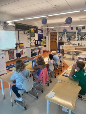 Michael Massaro reads his journal entry to classmates during a reading and writing exercise.