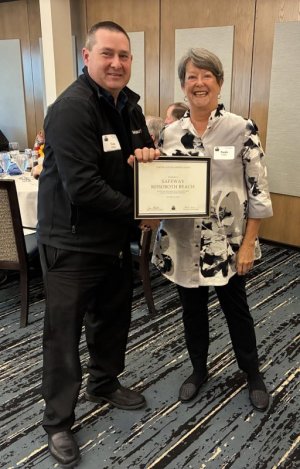 Cape Henlopen Food Basket board member Paula Conti, right, presents a certificate of appreciation to Tom Adkins, Safeway Rehoboth Beach manager. SUBMITTED PHOTOS