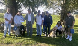 The Elks donation of $1,000 was made to representatives of Canines Assisting Service Heroes and matched by another $1,000 from Elks member Karen Palmer. Shown are (l-r) Dan Celia, Elizabeth Short with Cash, Robert Trafton, Marty Schreck, Betty Ann Kortlang, Ken Parte and Echo, Mary DiGennaro, and Kilo with his owner Ray Harris.