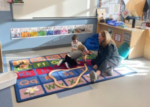 Little Vikings students (l-r) Ethan Graziano and Landon Shaw build train tracks as Dr. Cathy Brokaw, school psychologist, observes.