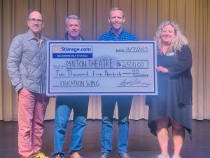 Check presentation attendees shown are (l-r) Fred Munzert, theatre director; Andy Strine and Casey Kenton, DEStorage.com principals; and Jacey Brittingham, theatre development director. SUBMITTED PHOTO