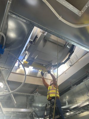 During the upgrade process, the new MRI is carefully lowered through the roof of Beebe’s imaging department.