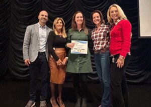 Megan Kellman, computer lab manager, receives the Cape district’s Going the Extra Mile staff award for Lewes Elementary. Shown are (l-r) Alfredo Rodriguez, assistant principal; Dr. Kimberly Corbidge, principal; Kellman; Alison Myers, school board president; and Dr. Jenny Nauman, superintendent.