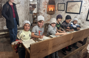 Rehoboth Elementary students try quill writing, practicing colonial-era handwriting with a feather and ink just as children did in the 18th and early 19th centuries. Shown are (l-r) Sebastian Garcia, Rory Garrity, Ian Ciaraldi, Nathan Vale-Booton, Dominic Montoya and Victor Rivera Prudencio.