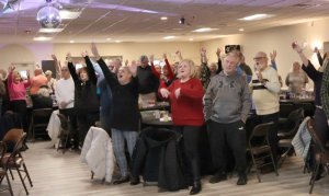 Elks members and guests wholeheartedly sing along to "God Bless the USA."