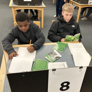 Students Dae'Vion Williams, left, Brodie Deas research and reflect on the Green Book.