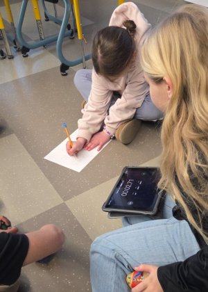 Aimee Micinowski, left, and McKenna Lunden clock their potato’s dance time.