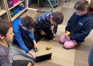 Timing their potatoes in the dance competition are (l-r) Axel Legates, Griffin Eanes, Joaquin Cortez-Garcia and Mea Greco.
